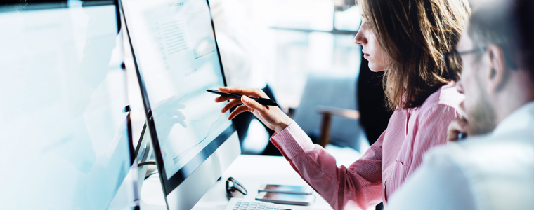 woman and man working on computer