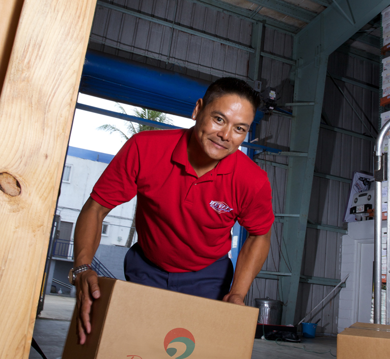 warehouse-worker-lifting-box-2-is-right mover with boxes