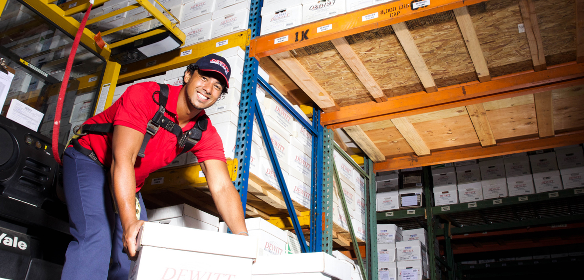 warehouse worker with records and documents
