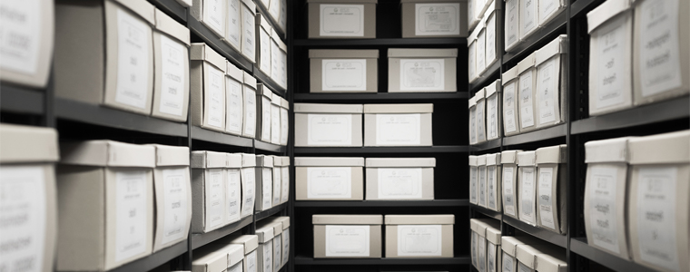 documents stacked in boxes