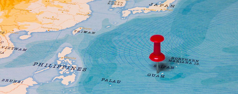 A Red Pin on Guam of the World Map
