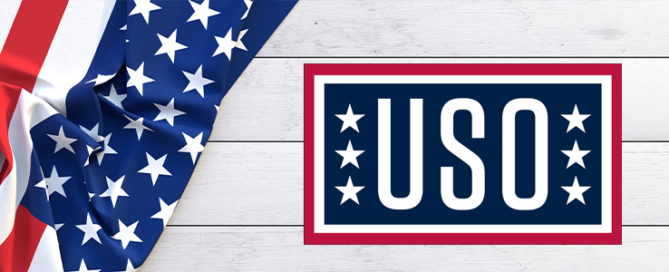 American flag on wood background with USO logo