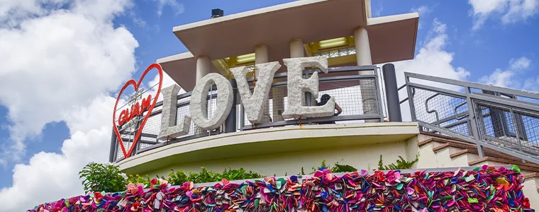 Two lovers point look out view point with Love,GUAM, Red Heart sign: Close up view with many locks