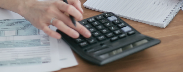 Woman using a calculator