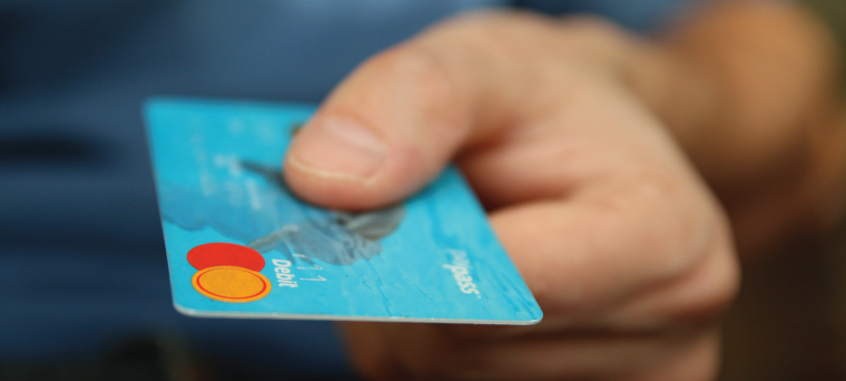 Man handing over a credit card