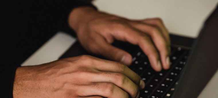 Man typing on a computer